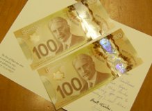 colourful Canadian $100 bills