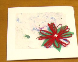 wax marbled paper with a daisy-winder poinsettia