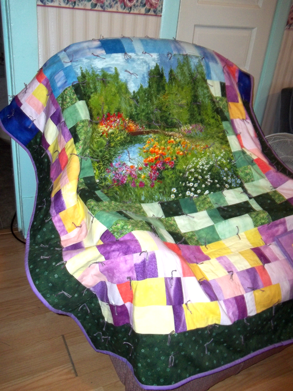 beautiful quilt spread over my recliner